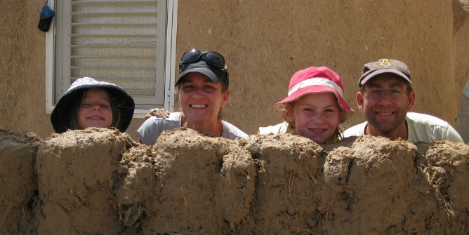 A family volunteering through Go-Eco.
