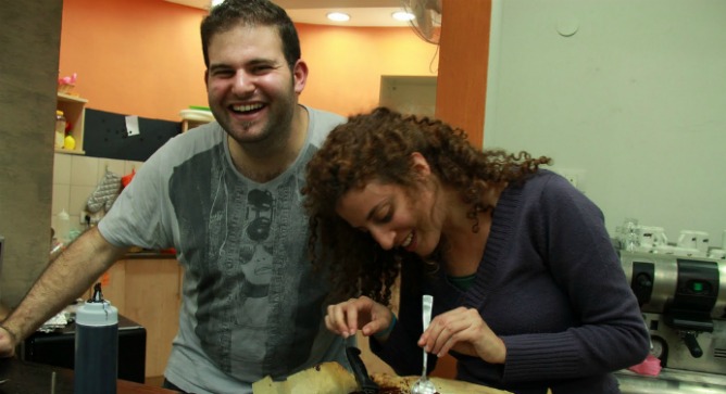 Tel-Hai biotechnology major Eliran Smilovich and education major Naama Kohavi have worked at Café Motek for three years. Kohavi plans to continue volunteering there after she graduates. Photo courtesy of Enosh