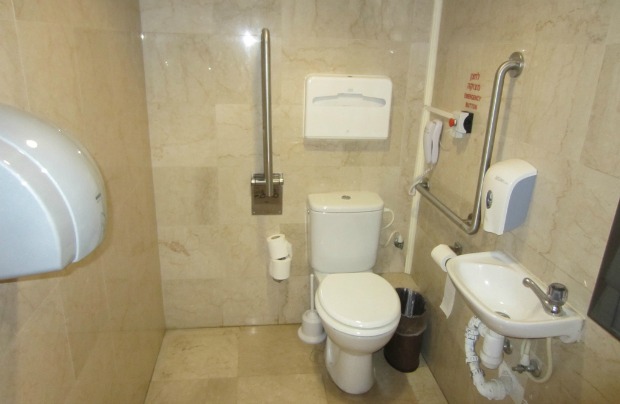 The bathroom in an accessible room at the Haifa Crowne Plaza has all the right requirements: plenty of space for a wheelchair, grab bars, panic button, phone, and a sink that the chair can roll right up to. There’s also a roll-in shower.
