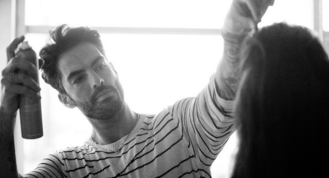 Antonio Corral Colero using Moroccanoil on a model’s hair.