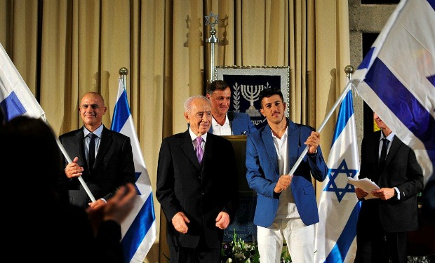 From left, Doron Shaziri, President Shimon Perez and Shahar Zubari at the Olympic and Paralympic sendoff at the President’s Residence, with Israel Olympic Committee secretary-general Efraim Zinger in background. Photo by Razi Livnat