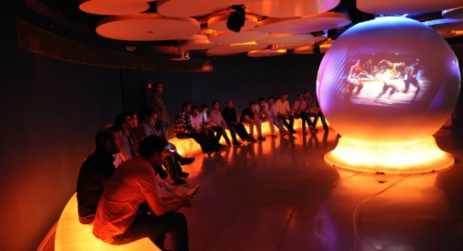 In the International Ring, visitors watch the world's best athletes on an enormous globe. Photo by Reuven Swartz