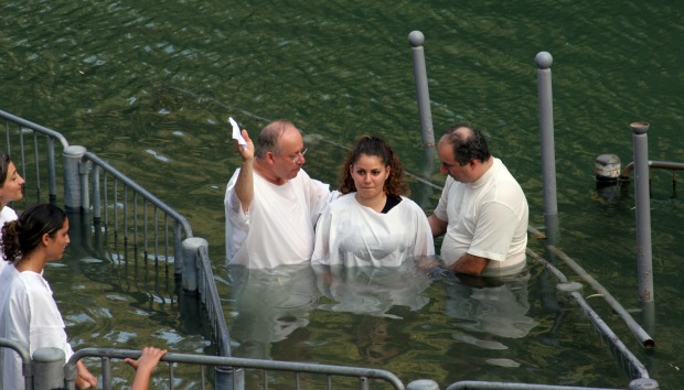 Baptism at the River Jordan. Photo by www.shutterstock.com