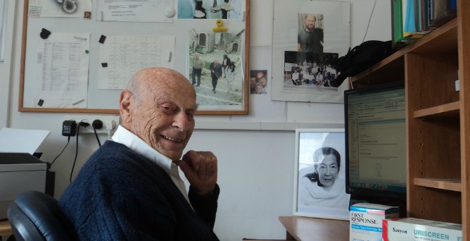 Citri at his university office, surrounded by photos of his late wife and son, along with other diagnostic kits he’s invented. Photo by Lorena Sabater