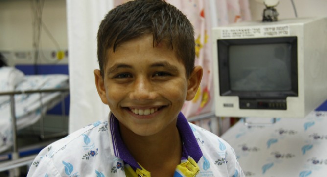 Mohamed Ashgar from Gaza waiting for his heart sugery. Photo by Sheila Shalhevet.