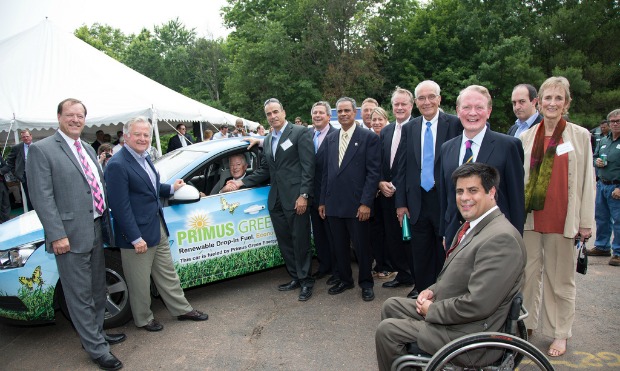 Primus Green Energy executives and guests checking out the demo vehicle fueled by Primus biofuel.