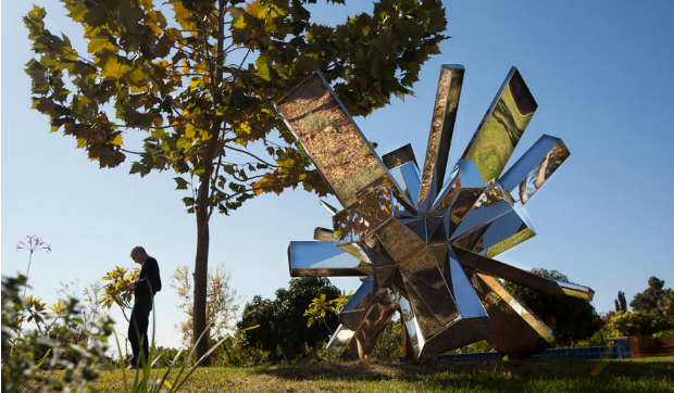 rock-growth Levy with his stainless steel Rock Growth, in a private collection in Israel. Photo by Shauli Landner