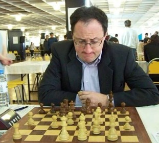 Grandmaster Gelfand pondering a move.