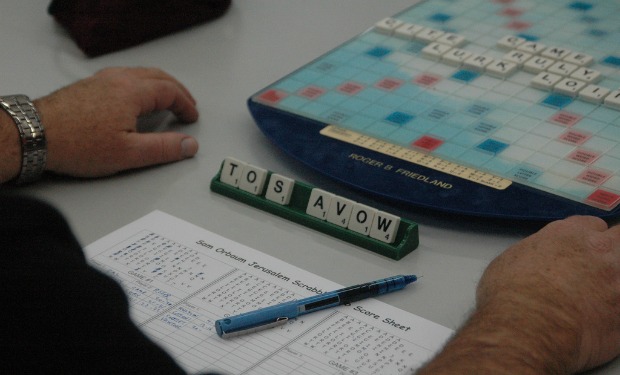 Club director Roger Friedland in the middle of a match. Photo by June Glazer
