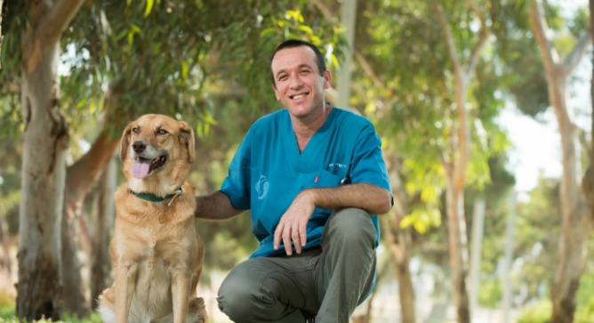 Dr. Yoel and one of his cancer-sniffing friends. Photo by Dani Machlis/BGU