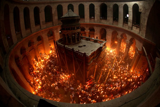 Christian Orthodox worshippers celebrating Easter at the Church of the Holy Sepulcher in Jerusalem. Photo by Gali Tibbon