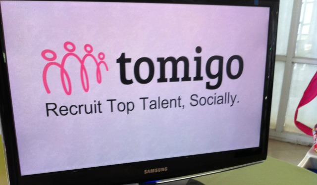 tomigo-logo The logo is sign language for “pay it forward.”