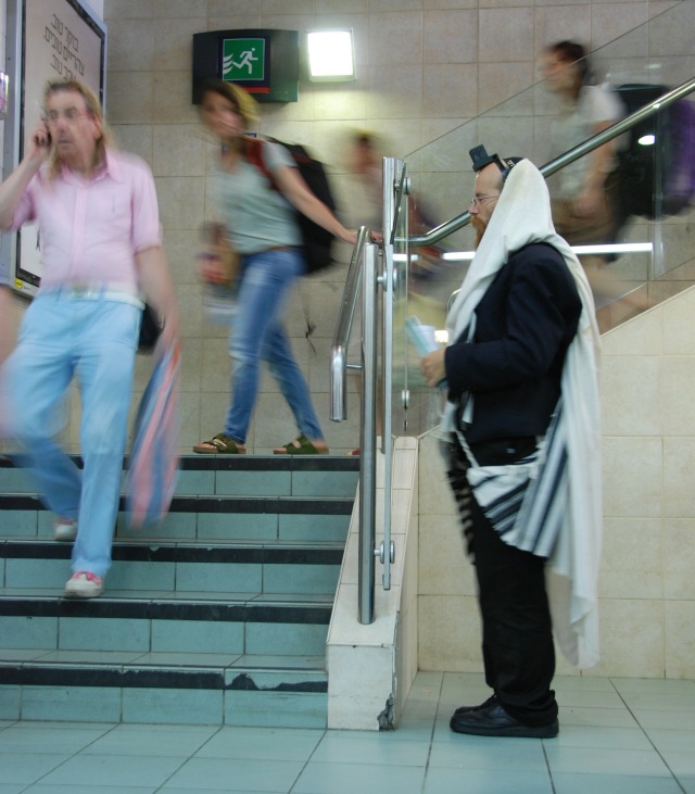 Praying in train station