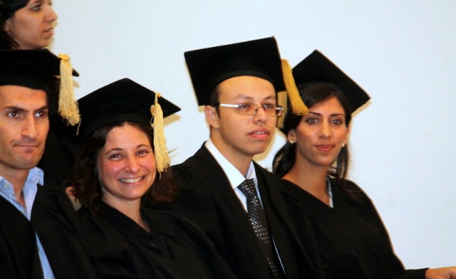 The valedictorian is seated at far right.