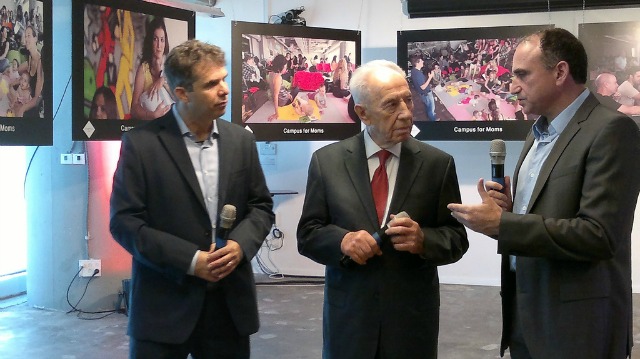 peres-google-campus Google Israel Managing Director Meir Brand, left, and Google Israel R&D Center Managing Director Yossi Matias telling Peres about Campus for Moms.