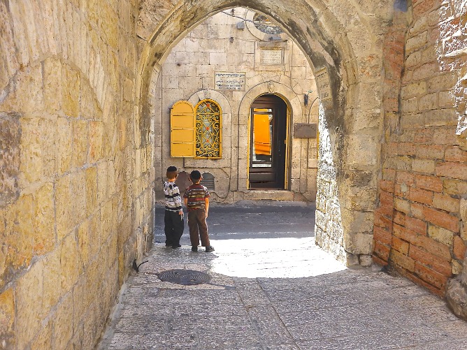 Two boys waiting in Jerusalem