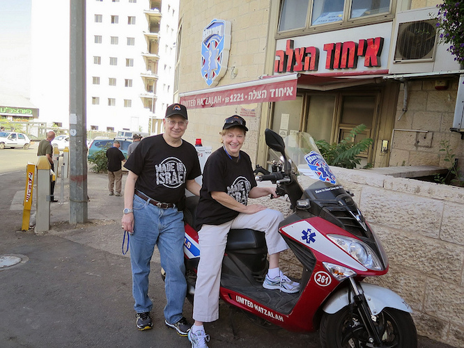 Steven and Karen Ostrove check out an ambucycle outside United Hatzalah headquarters in Jerusalem