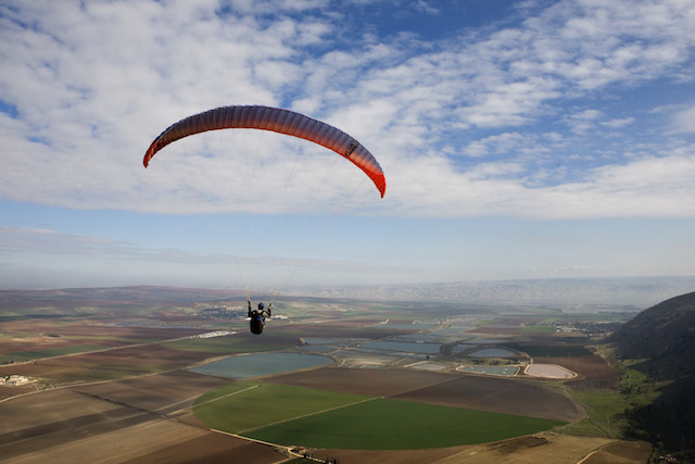 Israelis love extreme adventures, like paragliding over the Jezreel Valley shown in this photo by Matanya Tausig of Flash90.