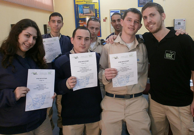 Cadets at Amal Holtz High School in Tel Aviv with their mentor, right.