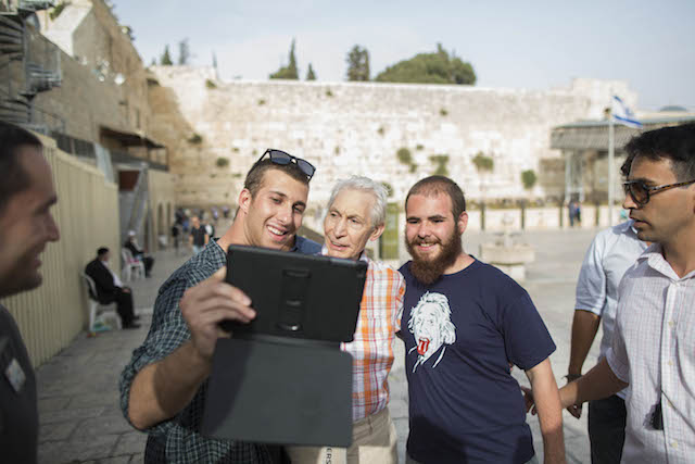 The Rolling Stones drummer Charlie Watts stopped for selfies with fans during the band’s visit to Jerusalem’s Western Wall. Photo by Yonatan Sindel/Flash 90