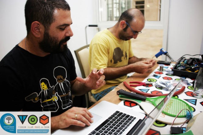 Saron Paz and Zvika Markfeld working on their idea.