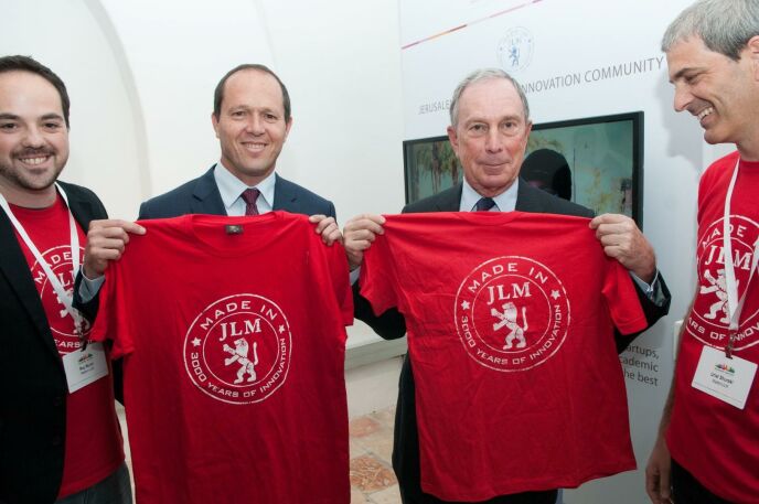 MadeinJLM community manager Roy Munin and cofounder Uriel Shuraki flanking Jerusalem Mayor Nir Barkat and former New York City Mayor Michael Bloomberg.
