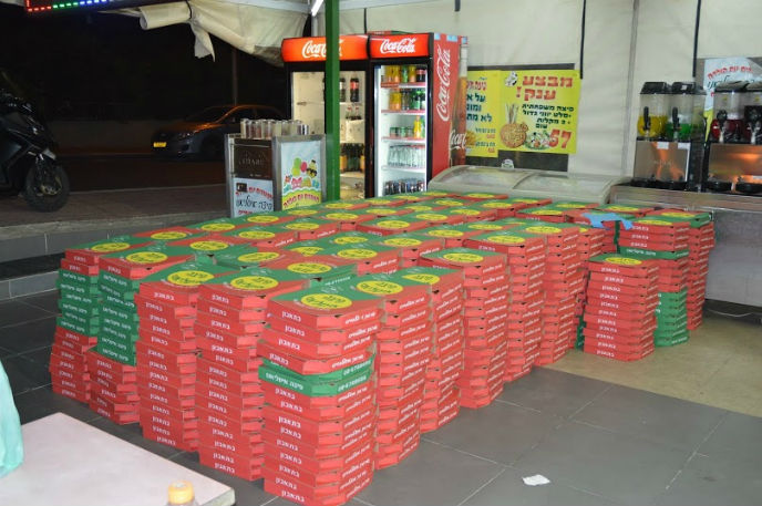 1,000 pizzas ready to be delivered to soldiers. Photo by Gedaliah Blum