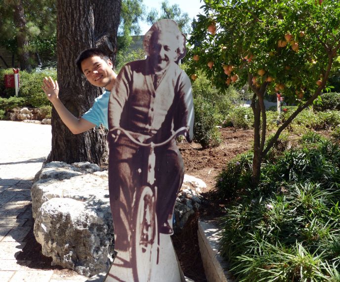 Lechao Tang behind the Albert Einstein statue at the Mount Scopus campus of the Hebrew University of Jerusalem. (Photo: Hebrew University)