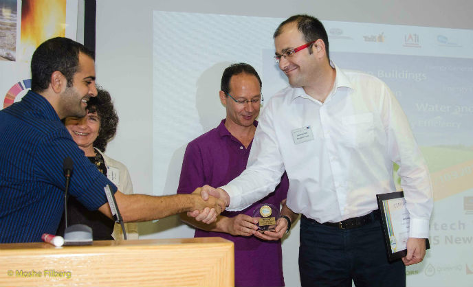 Noam Novich of AutoAgronom accepting the CleanTech Open award in Tel Aviv. Photo by Moshe Filberg.