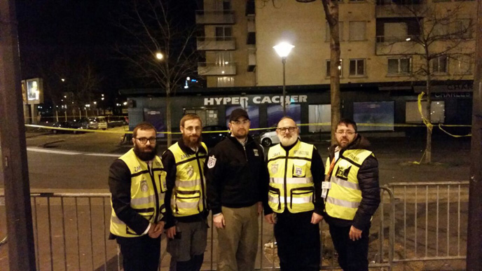 ZAKA International Rescue Unit head Mati Goldstein (center) is flanked by other ZAKA volunteers. (photo: ZAKA)