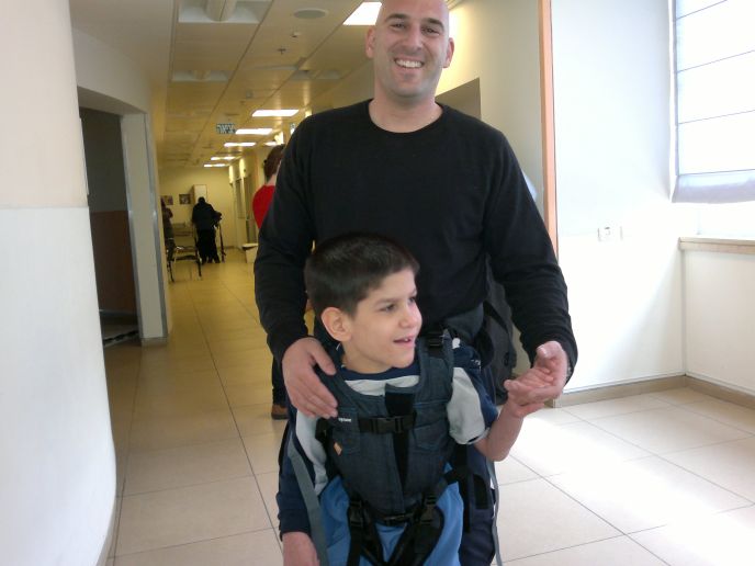 Officer Nir using an Upsee harness to train with his ALEH partner.