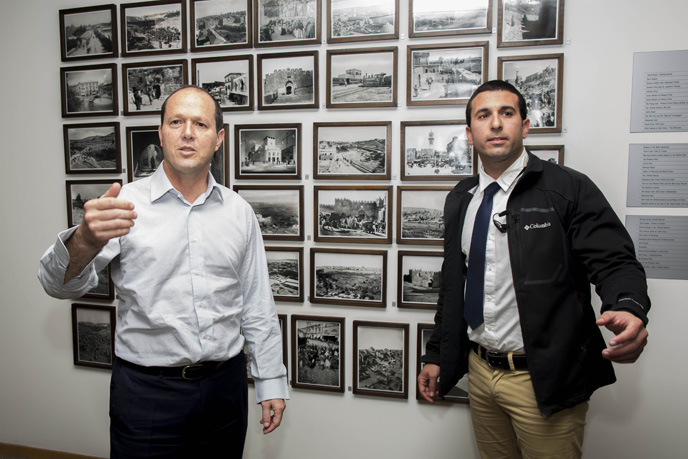 Jerusalem Mayor Nir Barkat and his security guard during a press conference at City Hall on February 22, 2015, after Barkat and his security official helped subdue a knife-wielding terrorist. Photo: Yonatan Sindel/FLASH90