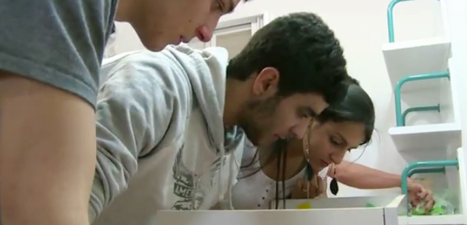 High-school students try to pick a lock to secure a future in science. (Screen grab from YouTube)