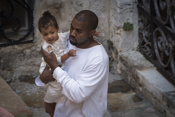 Singer Kanye West with his daughter, North, as they leave the Saint James Armenian Church in the Armenian Quarter in Jerusalem's Old City. Photo by Hadas Parush/Flash90