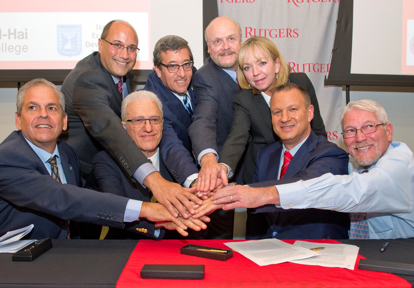 Memo of understanding signers, from left, front row: Giora Salz, chairman of the Upper Galilee Regional Council; Yossi Mekori, incoming president of Tel-Hai College; Erel Margalit; and Rutgers School of Environmental and Biological Sciences Executive Dean Robert Goodman, also executive director of Rutgers NJAES. In the back row Lou Cooperhouse, director of the Rutgers Food Innovation Center; Mark Levenson, chair of the New Jersey-Israel Commission; Chris Molloy, senior VP of research & economic development at Rutgers; and Michele Brown, president and CEO of Choose New Jersey. Photo by Ron Sachs