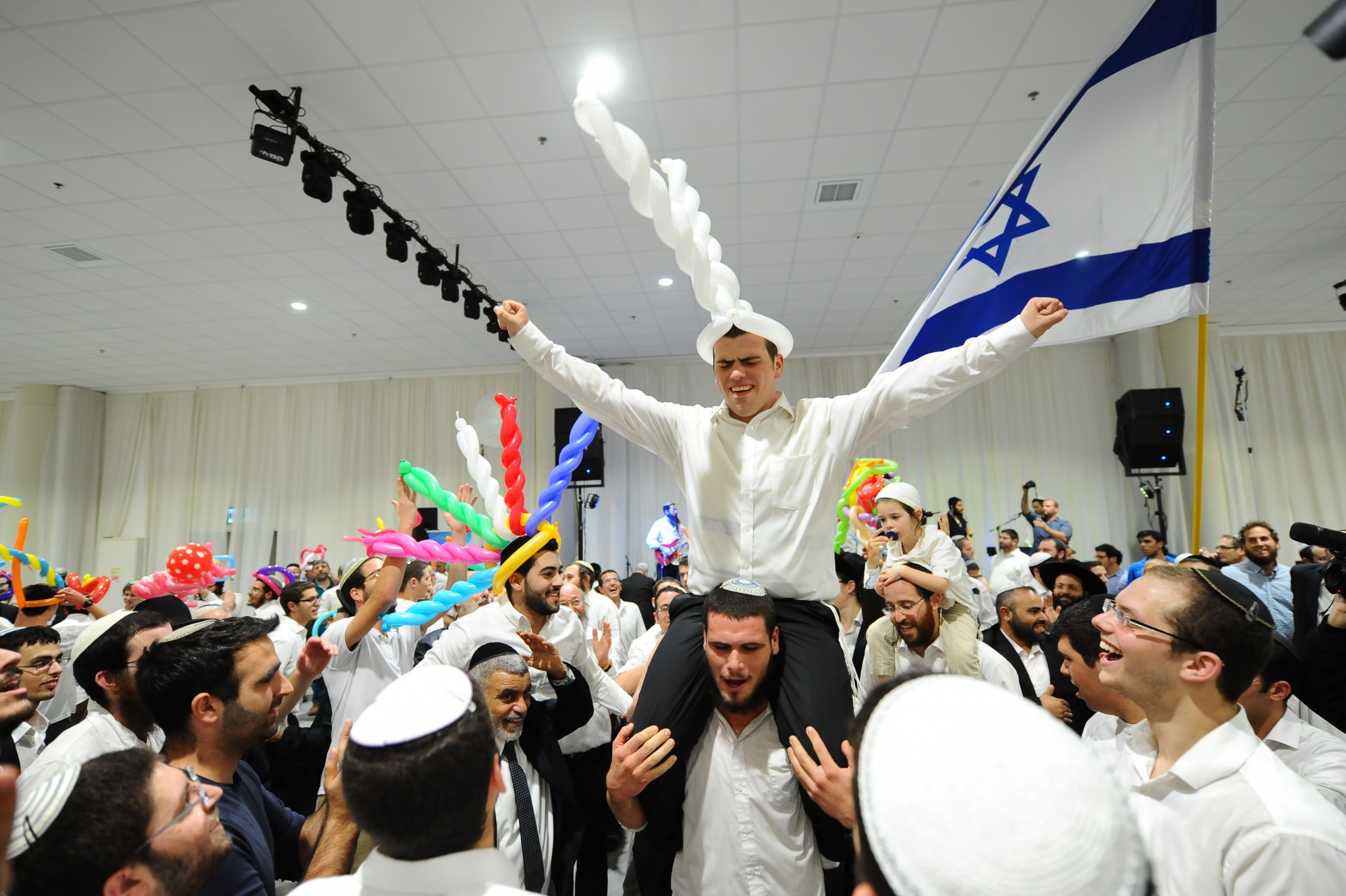 Groom Ariel Beigel, center, celebrating with thousands of guests at his Jerusalem wedding to Sarah Litman on November 26, 2015. Photo by Mendy HechtmanFLASH90 Groom Ariel Beigel, center, celebrating with thousands of guests at his Jerusalem wedding to Sarah Litman on November 26, 2015. Photo by Mendy Hechtman/FLASH90