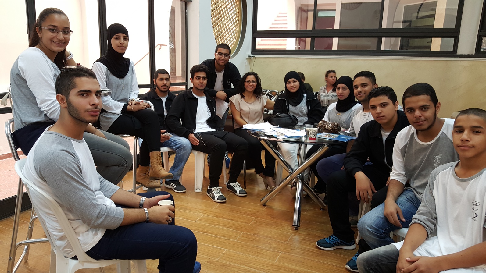 Amer Mgarbh (leaning, center) and his teacher (center) with a group of ORT Lod students who escorted visitors around town. Photo by Abigail Klein Leichman