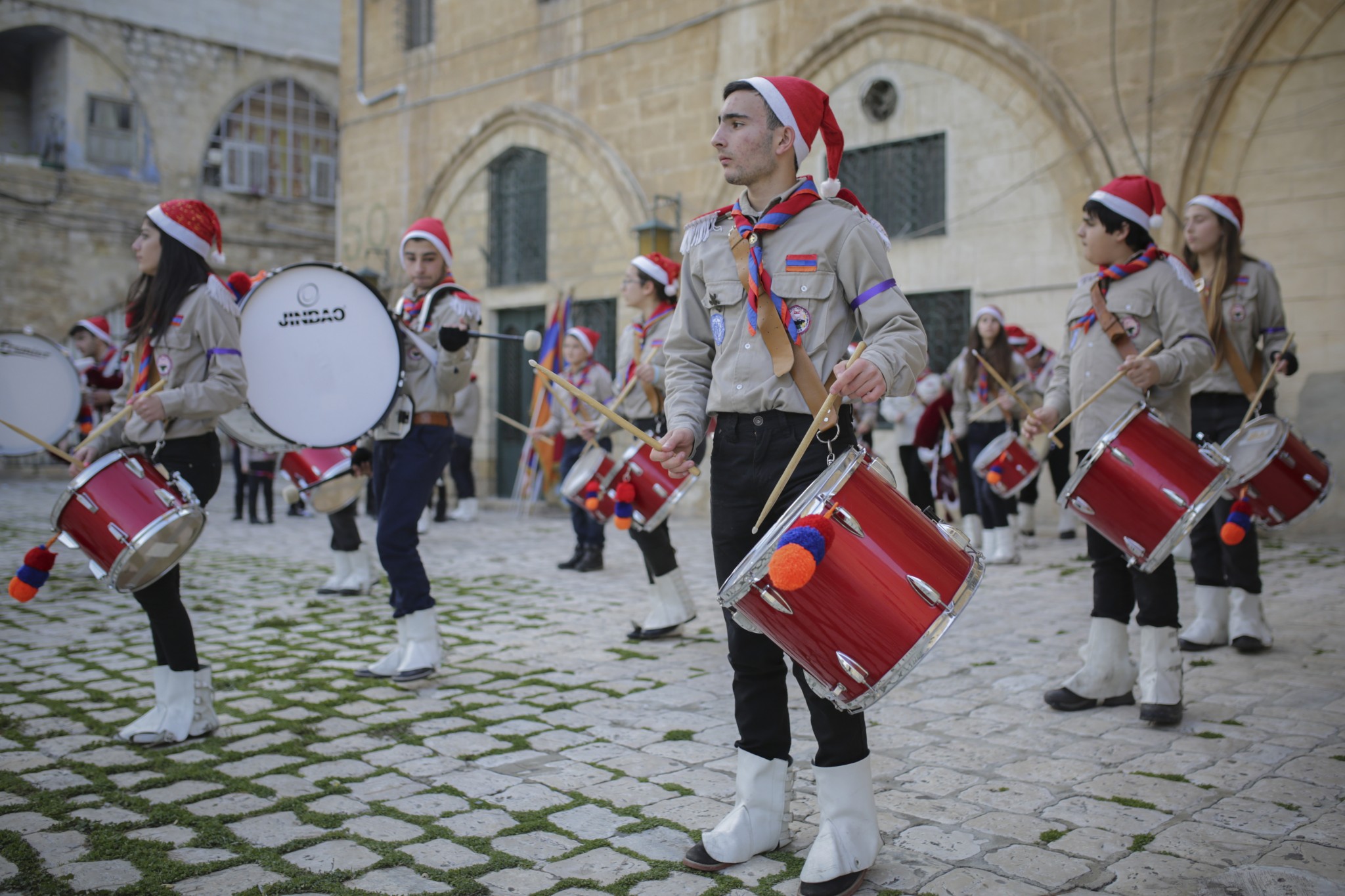 Christians march during an Armenian Christmas procession through the Old City of Jerusalem. Photo by Maxim DinshteinFLASH90