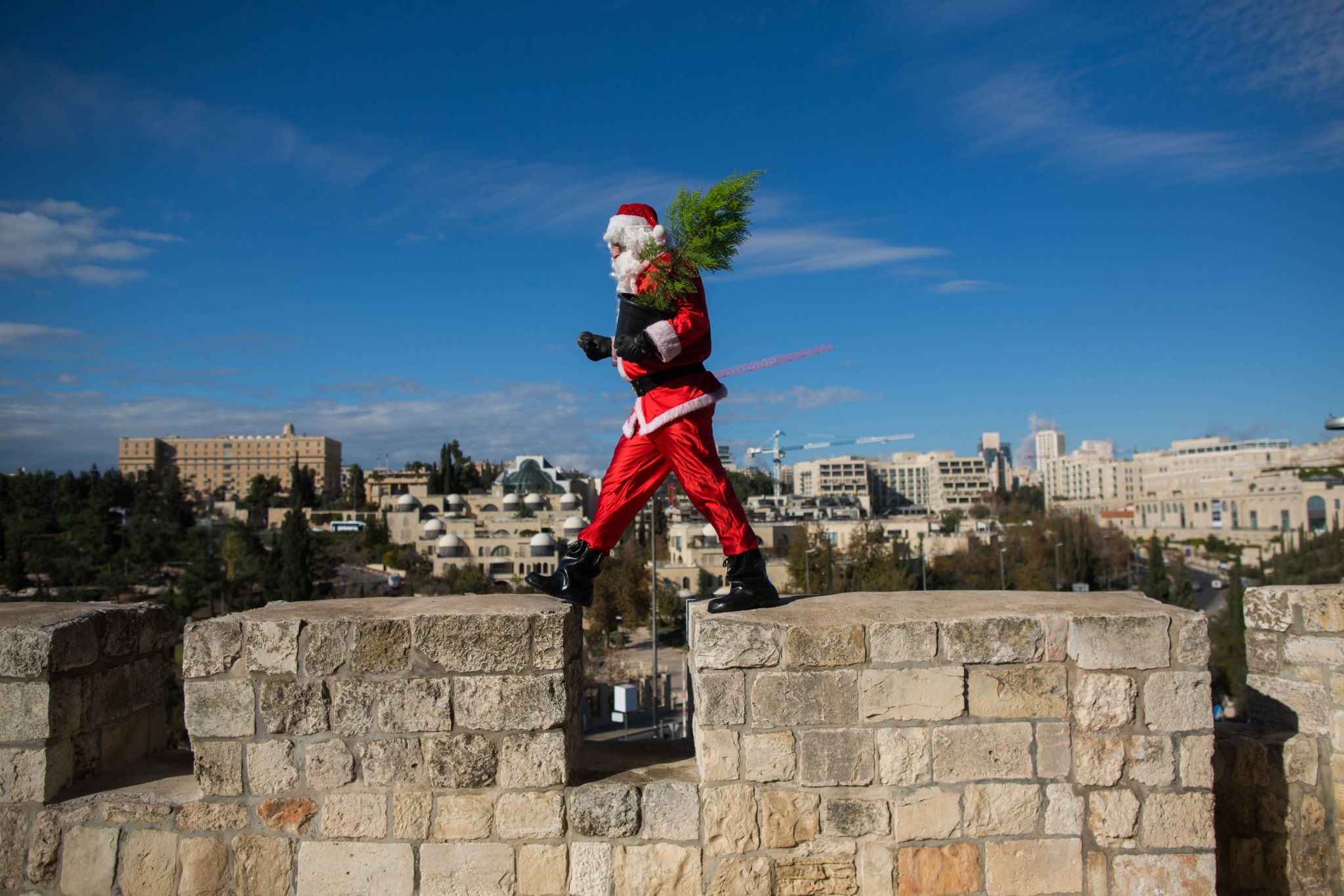 Santa walks the walls of Jerusalem's Old City last December. Photo by Yonatan SindelFLASH90