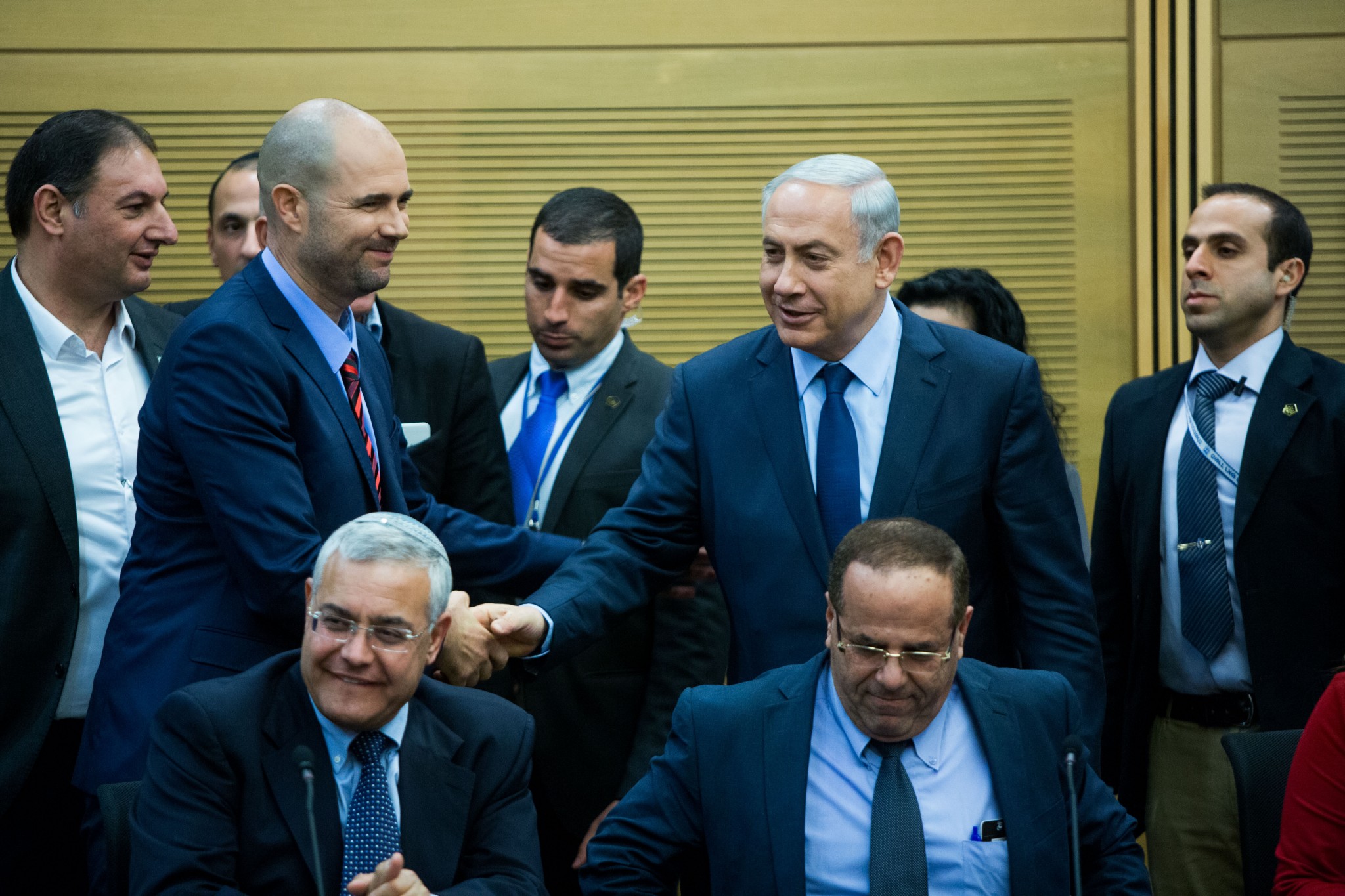 Prime Minister Benjamin Netanyahu shakes hands with new Likud MK Amir Ohana during a party faction meeting at the Knesset. Photo by Yonatan Sindel/Flash90