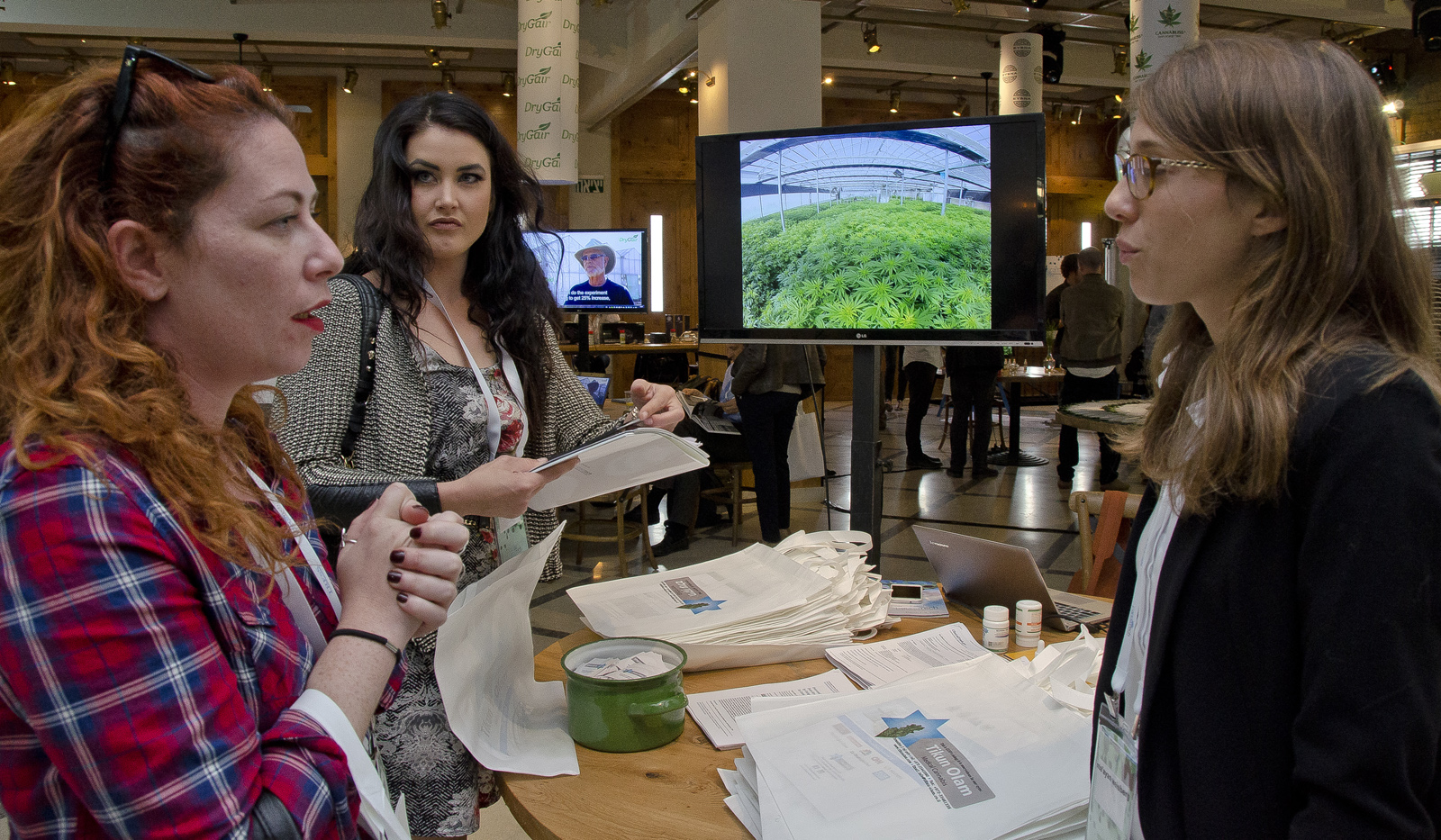 Canna Tech participants chat at the Tikun Olam exhibitors booth. Photo: courtesy