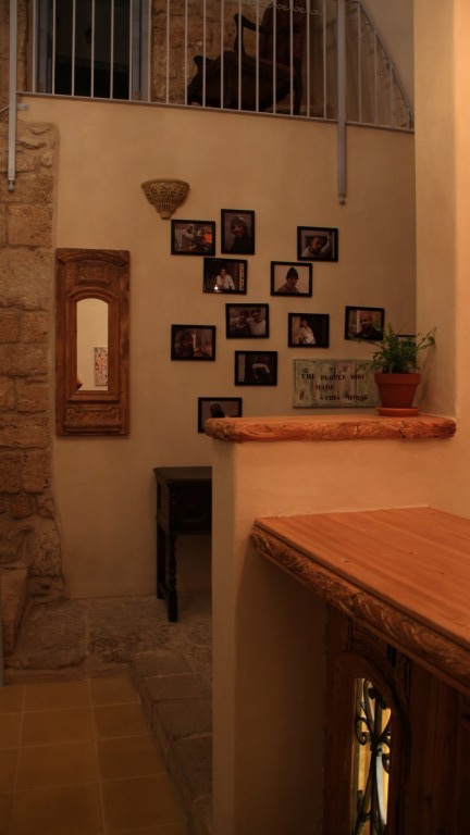 Fallenberg hung portraits of the artisans who renovated the house. Photo by Micha Fallenberg Fallenberg hung portraits of the artisans who renovated the house. Photo by Micha Fallenberg