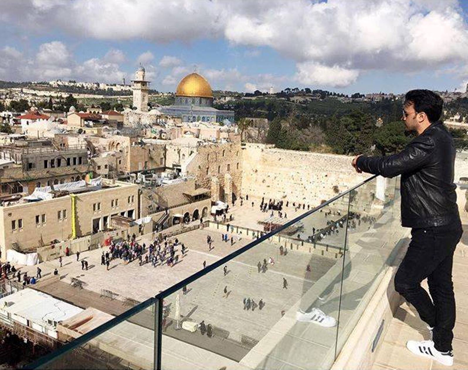Luis Fonsi looking out at the Western Wall and Temple Mount in Jerusalem. Photo via Facebook