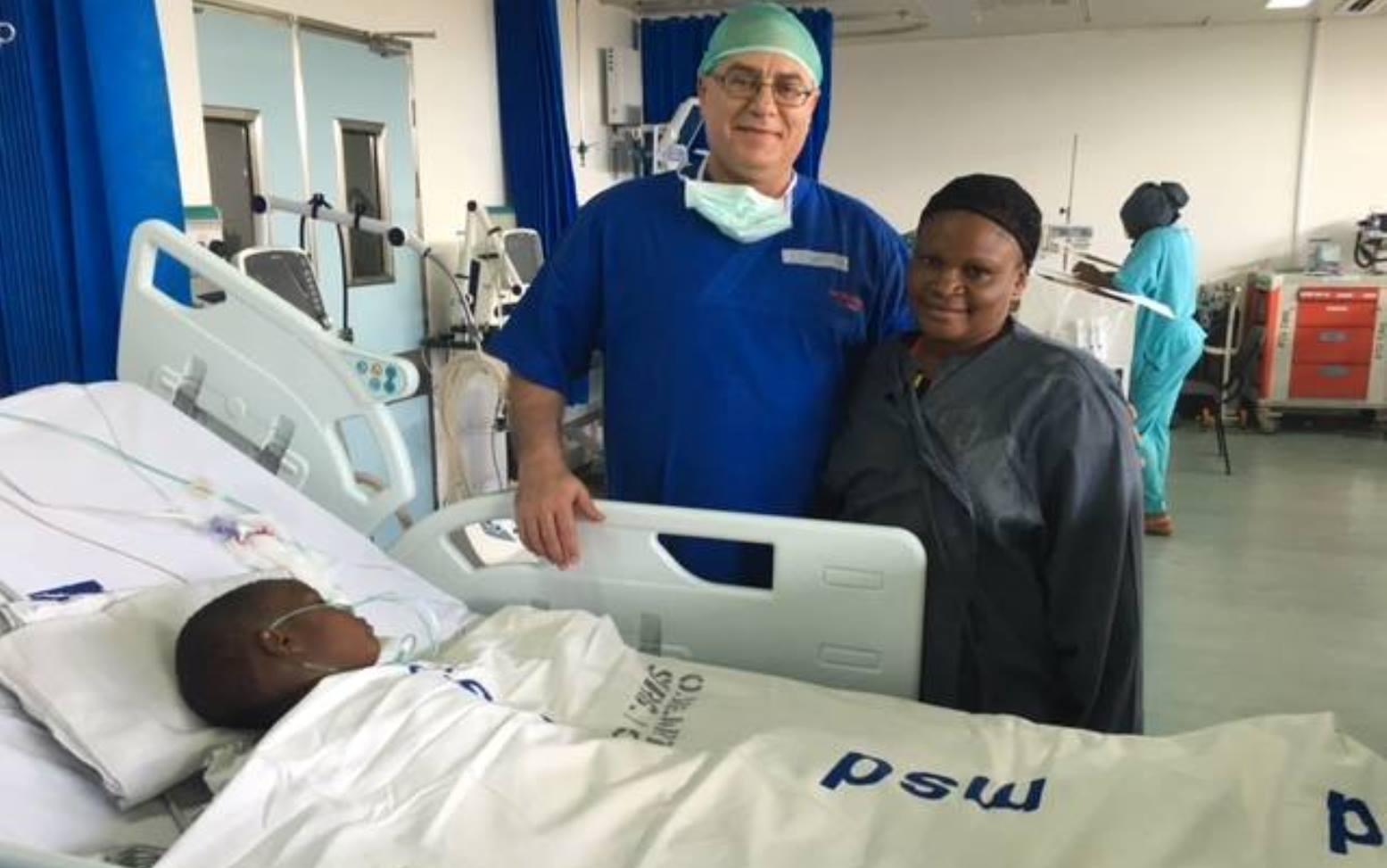 Dr. Lior Sasson, Save A Child's Heart lead surgeon, with a mother whose daughter had successful surgery on March 8. Photo courtesy of SACH Dr. Lior Sasson, Save A Child's Heart lead surgeon, with a mother whose daughter had successful surgery on March 8. Photo courtesy of SACH