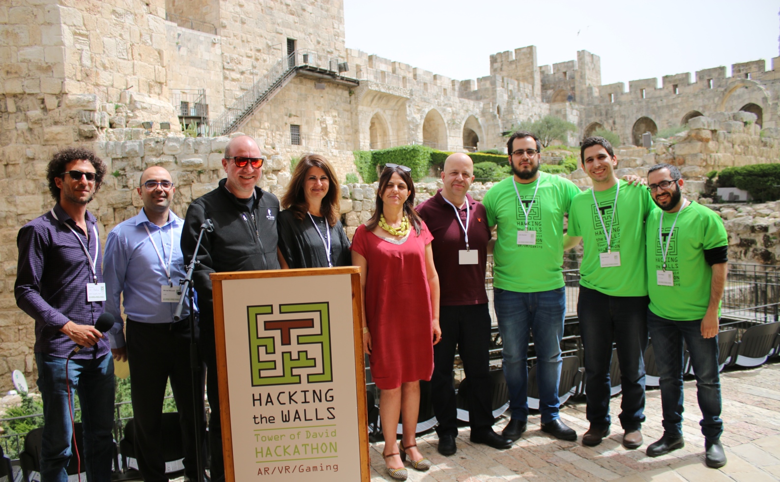  From left, Doron Ish Shalom, Michael Mizrahi, Elie Wurtman, Sarah Kass, Eilat Lieber, Itzik Ozer and third-place Hacking the Walls winner Clusteron. Photo courtesy of the Tower of David Museum