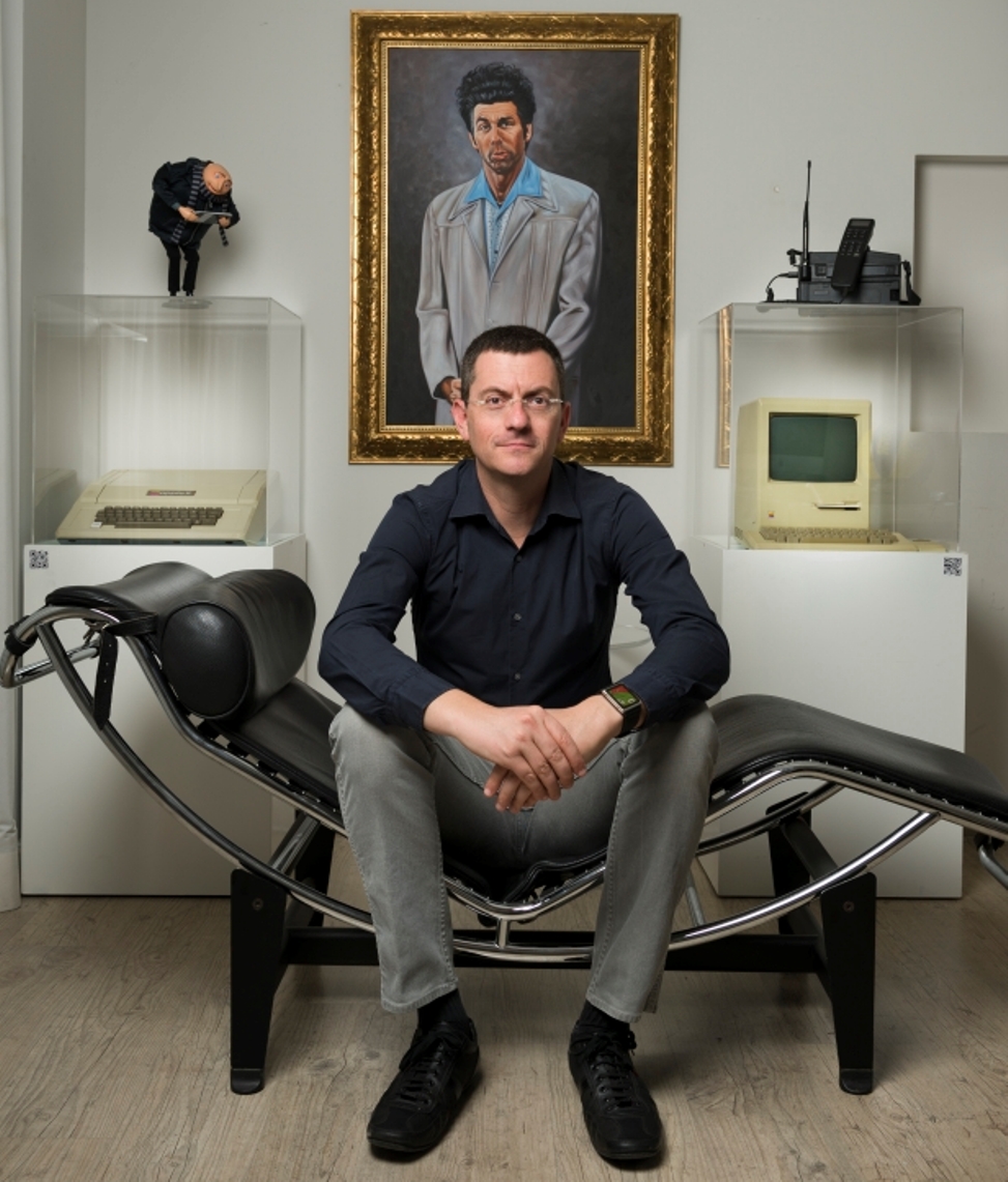 iApps Technologies CEO Ori Segal in his Herzliya office with with his Seinfeld and Apple collections.