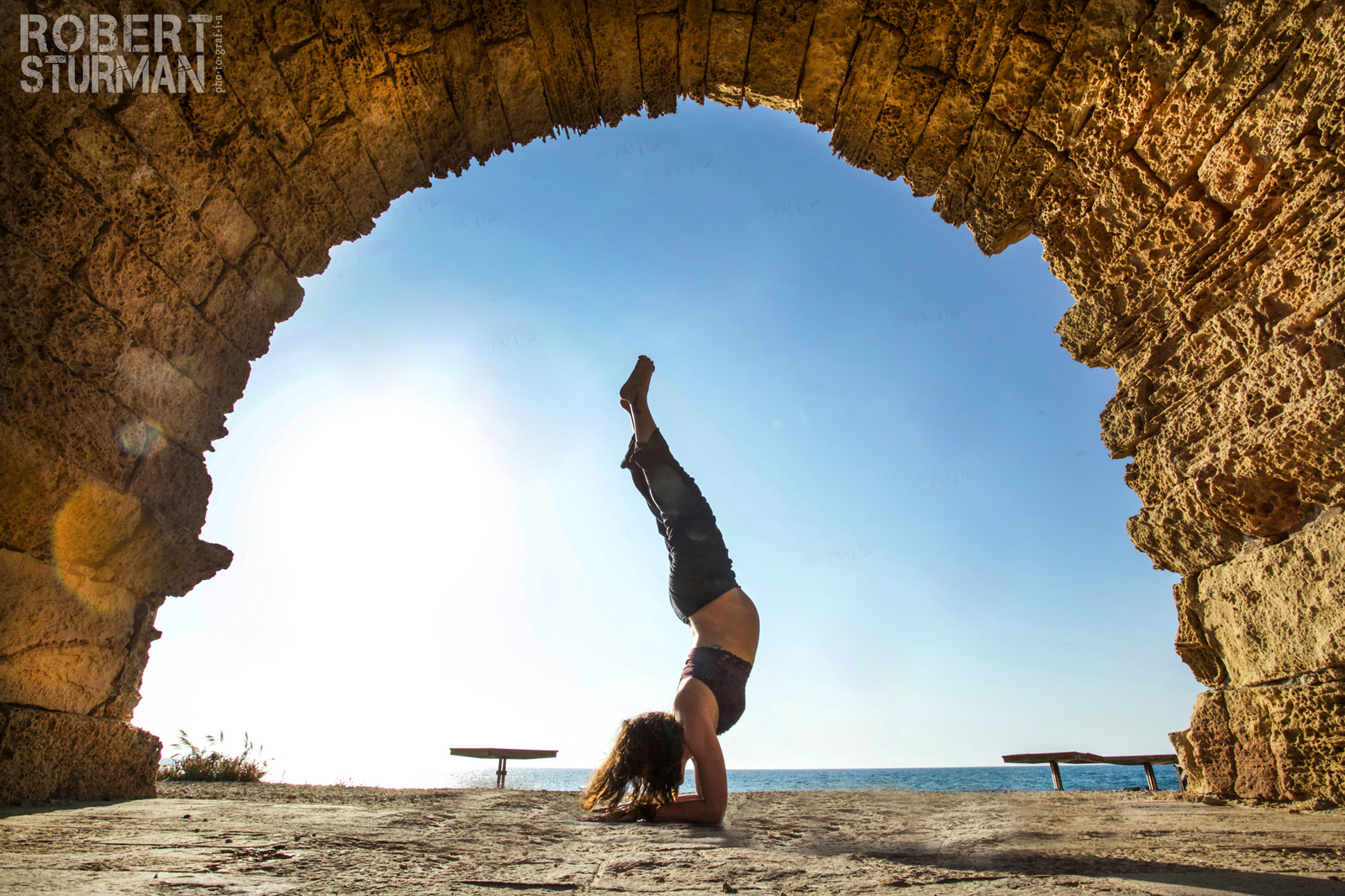 Shiri Segal striking a yoga pose in Caesarea. Photo by Robert Sturman