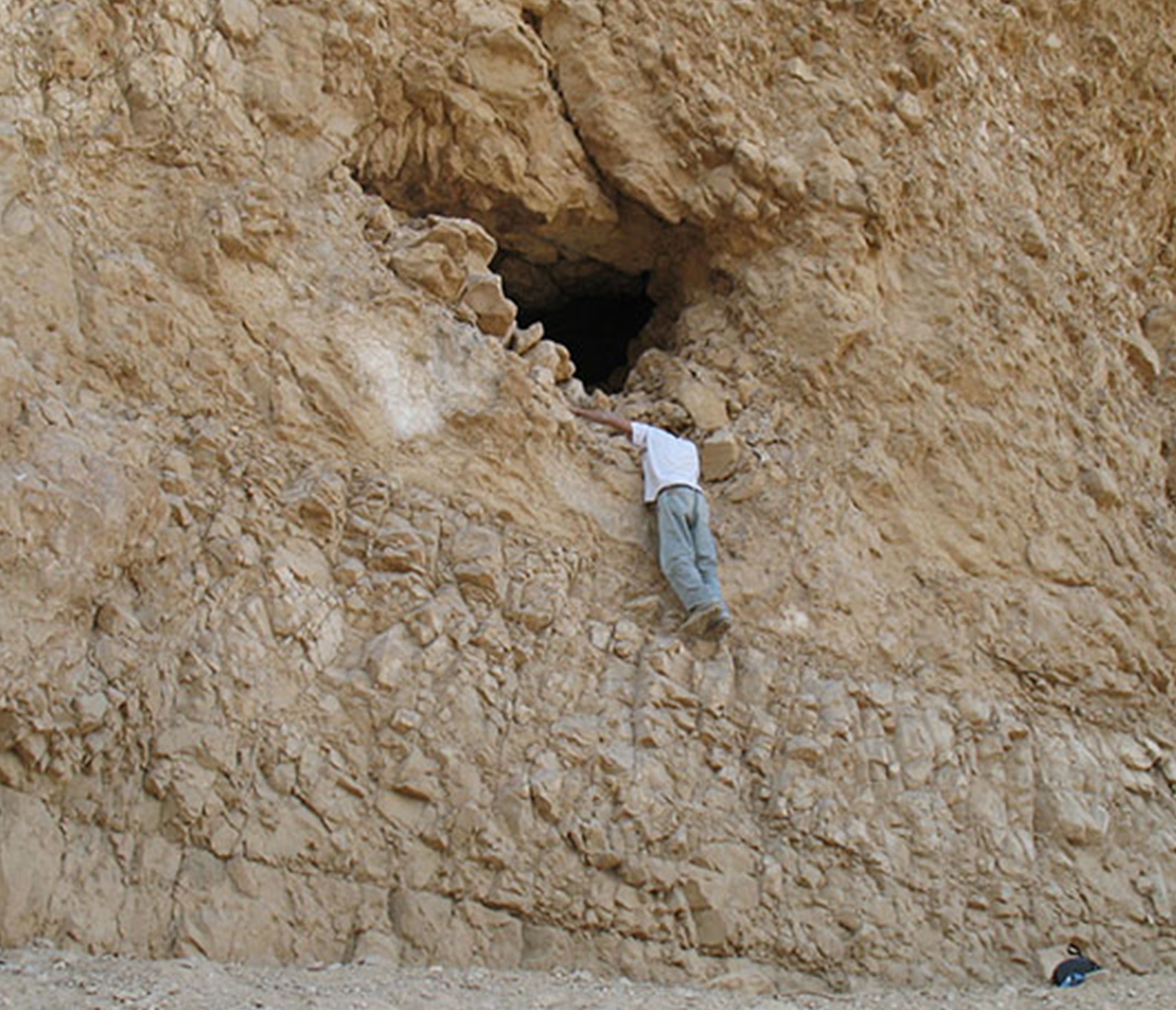 The entrance of Yoram Cave in an almost vertical cliff, some four meters above the trail leading to the cave. Photo by Ehud Weiss