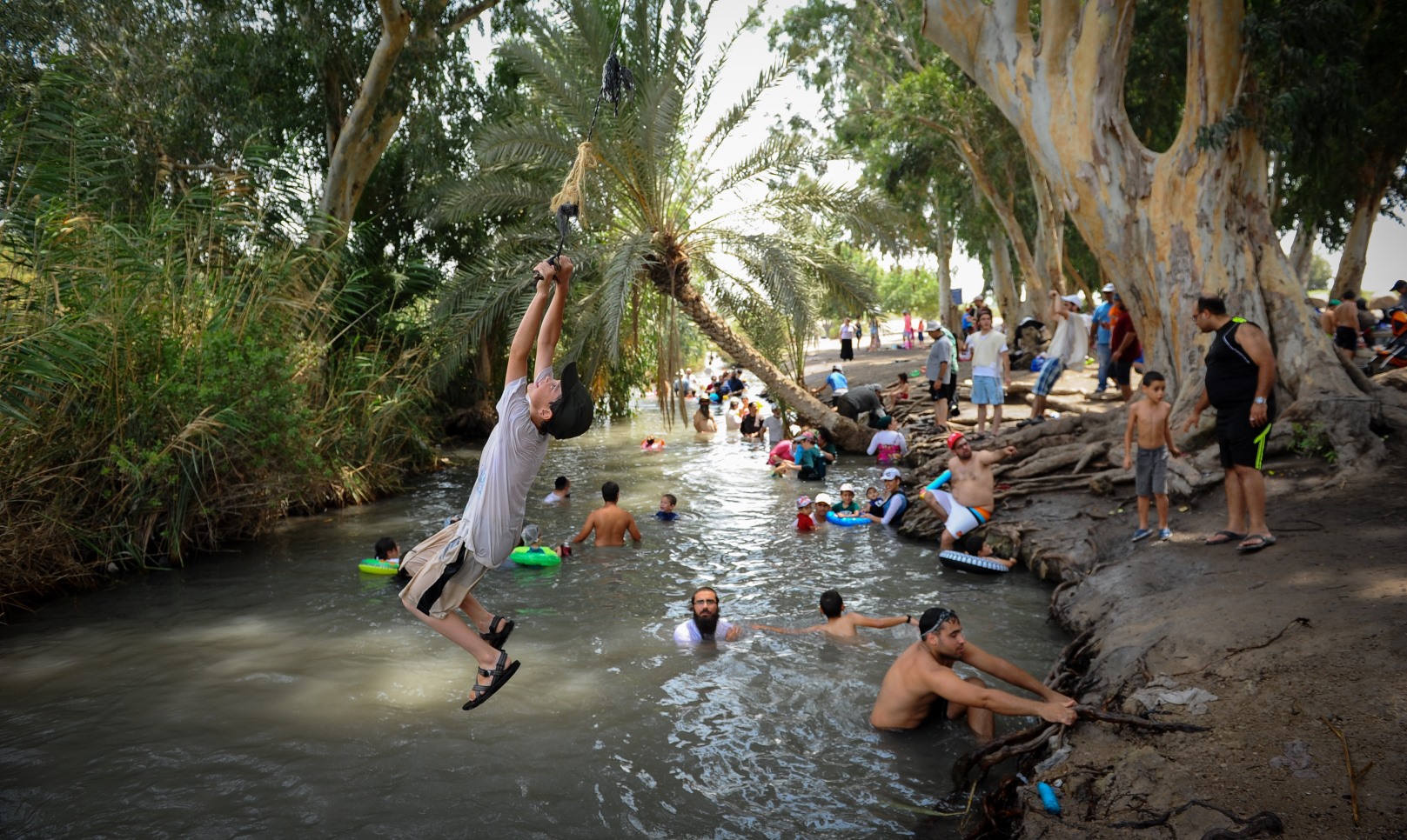 Israelis swim in a natural pool at Nahal Kibbutzim in Beit She’an, northern Israel. Photo by Mendy Hechtman/FLASH90