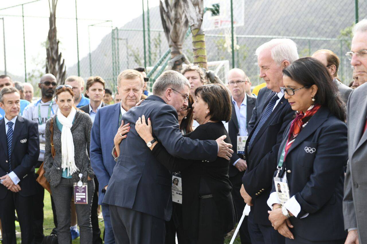 International Olympic Committee President Thomas Bach hugs widows of murdered Israelis during memorial ceremony in Rio. Photo via Israel Olympic Committee/Facebook